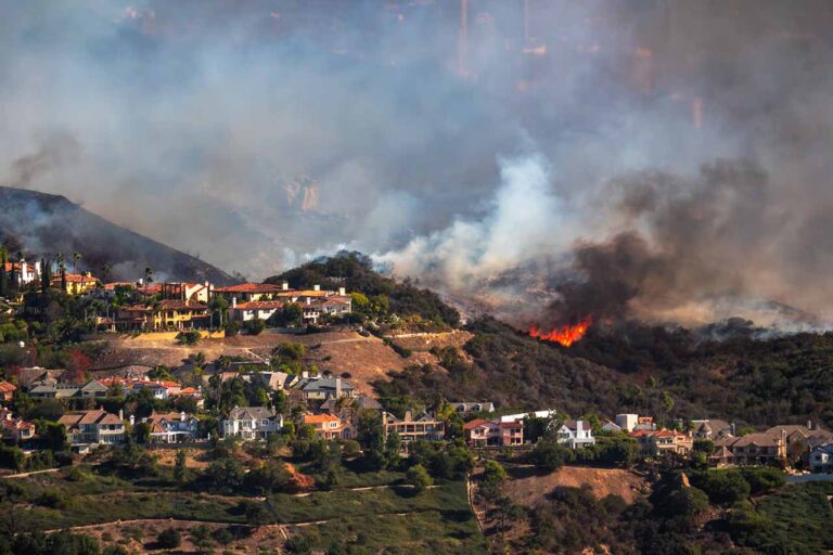 ca wildfire near homes los angeles background