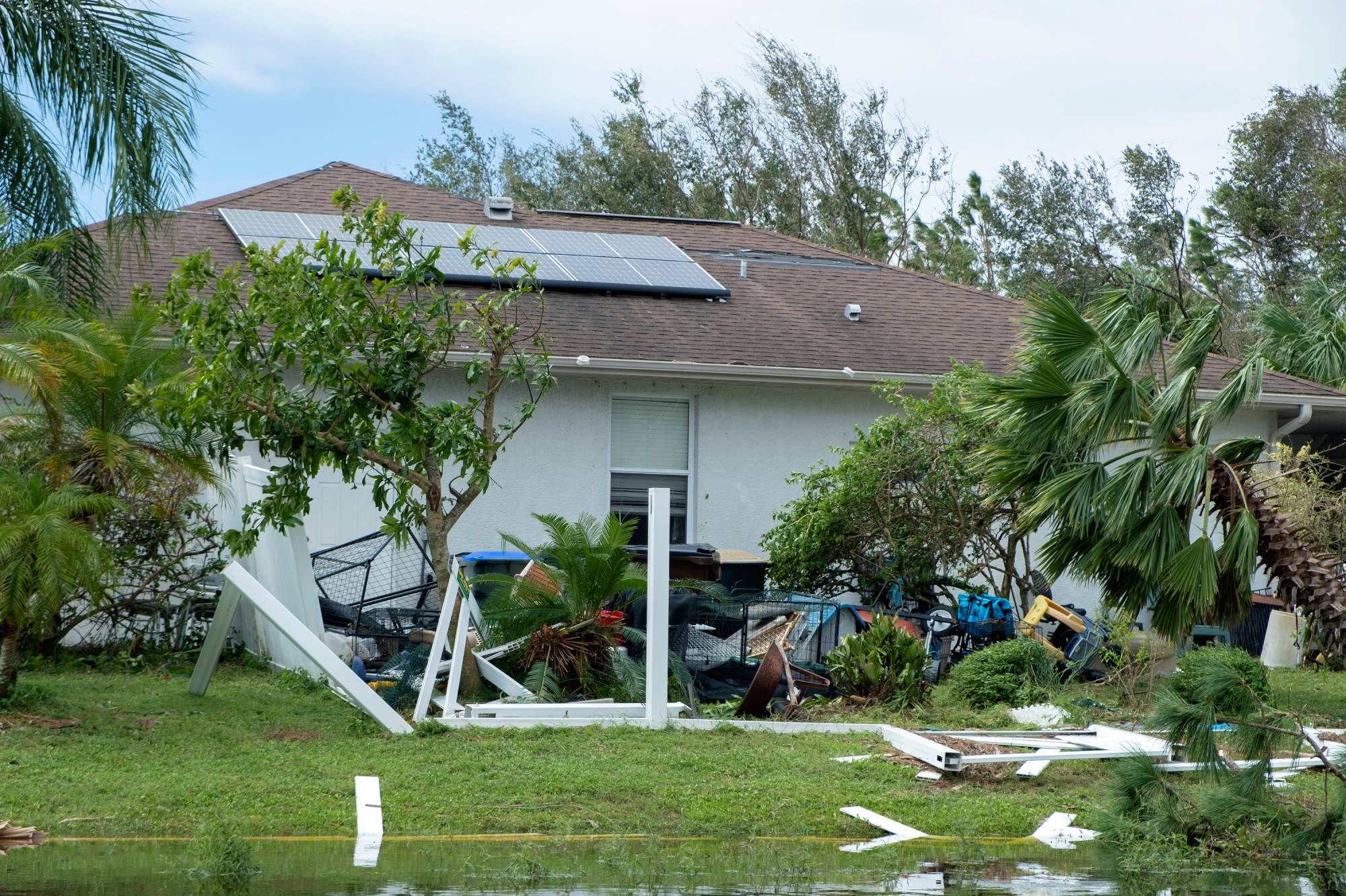 Backyard fence damaged after hurricane